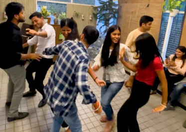 a group of people dancing on the floor
